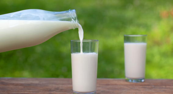 Fresh milk being poured from a bottle to a glass  - Source: Getty Images